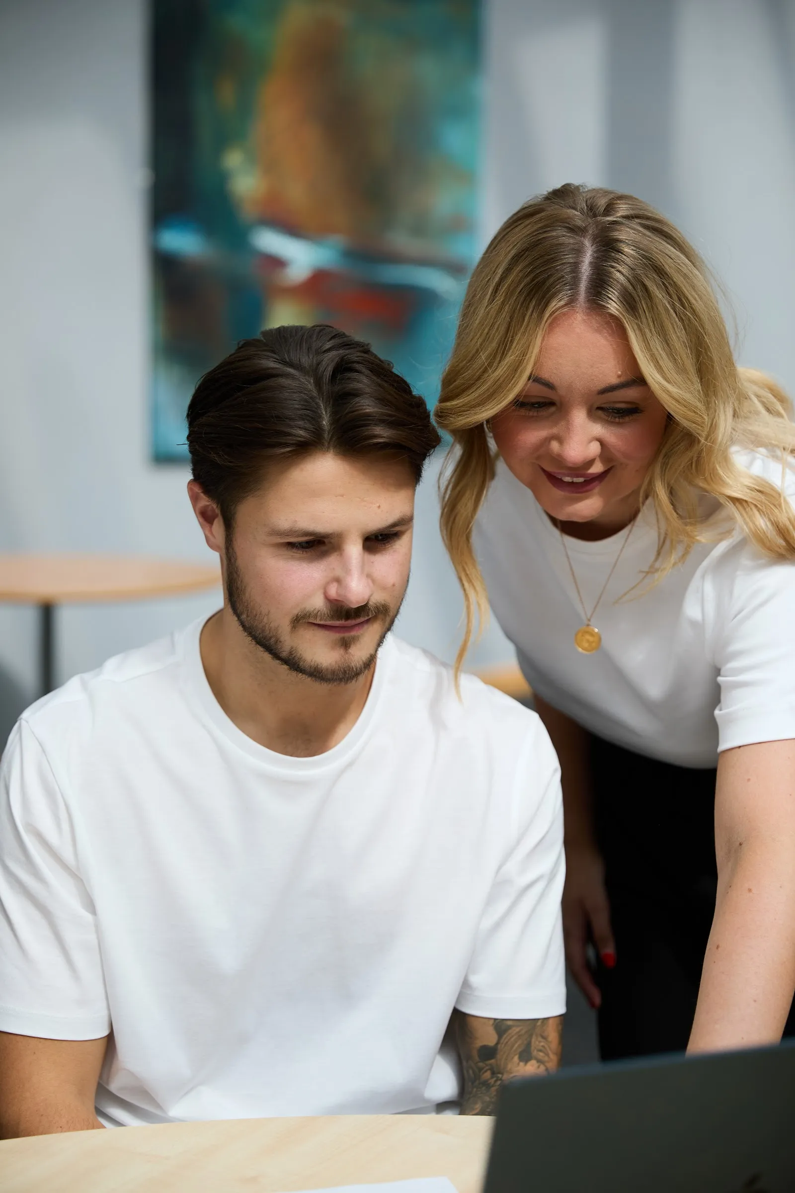 Two SBG Services team members sharing a laugh